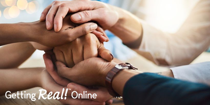 hands on top of each other with Getting Real Online logo