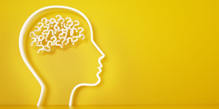 yellow background with white outline of human head and brain